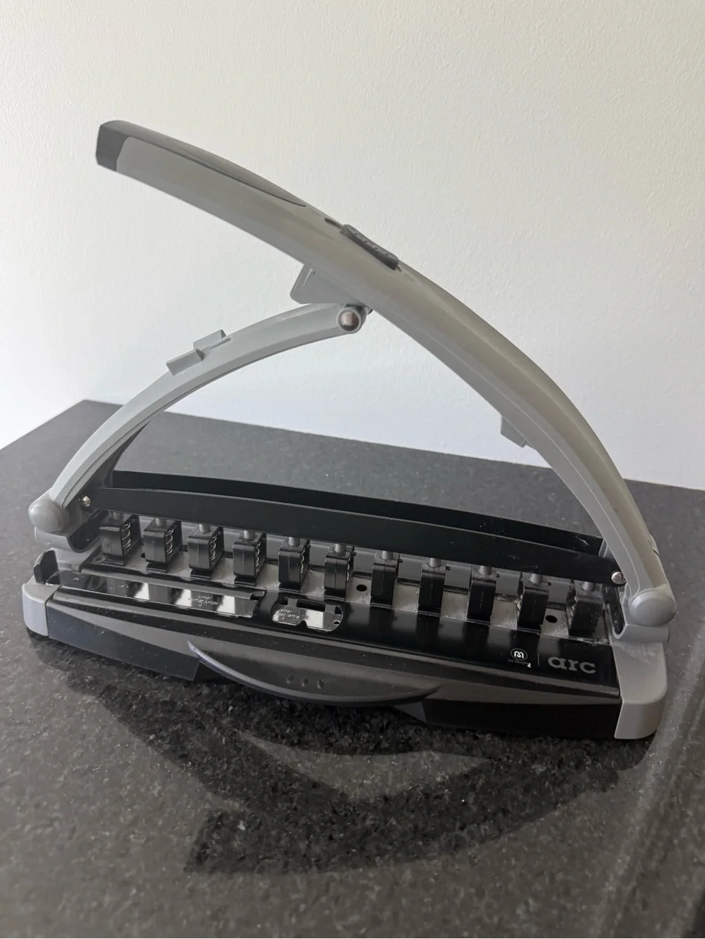 Staples Arc desktop paper punch in Gray and Black